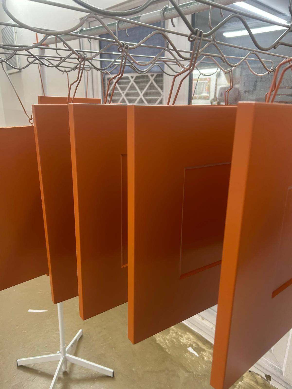 Freshly resprayed orange kitchen doors